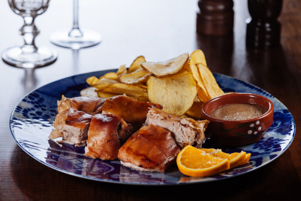 Hidden Gems in Leiria: A Local’s Guide to Portugal’s Most Underrated City roasted,sucking,pig,with,potato,chips,and,souce/traditional,portuguese,cuisine